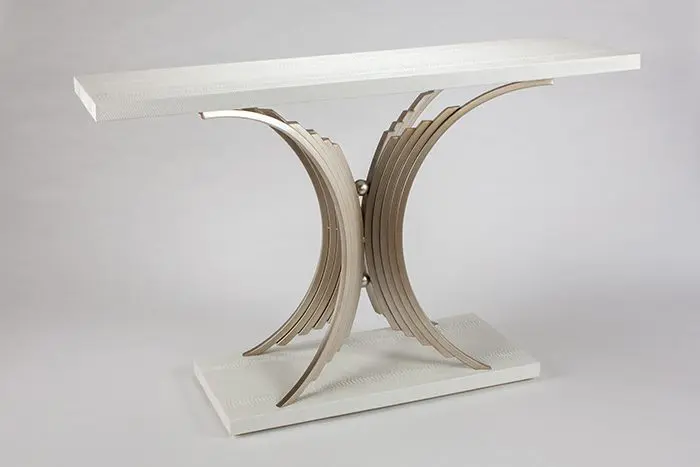 Modern console table with curved metal base.