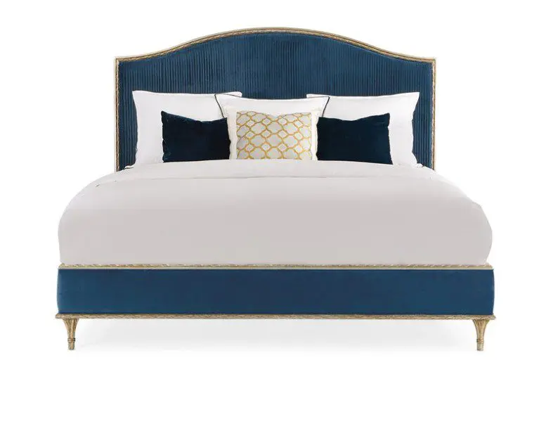 Elegant blue bed with decorative pillows