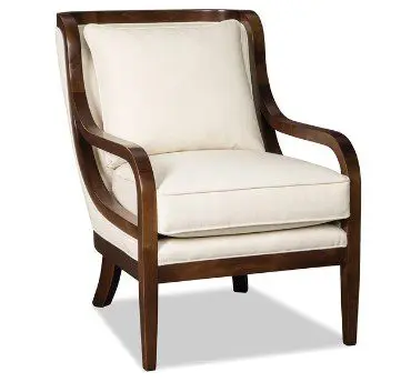 Wooden armchair with white cushions