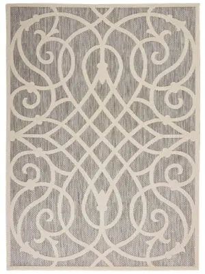 Intricate beige swirl pattern rug
