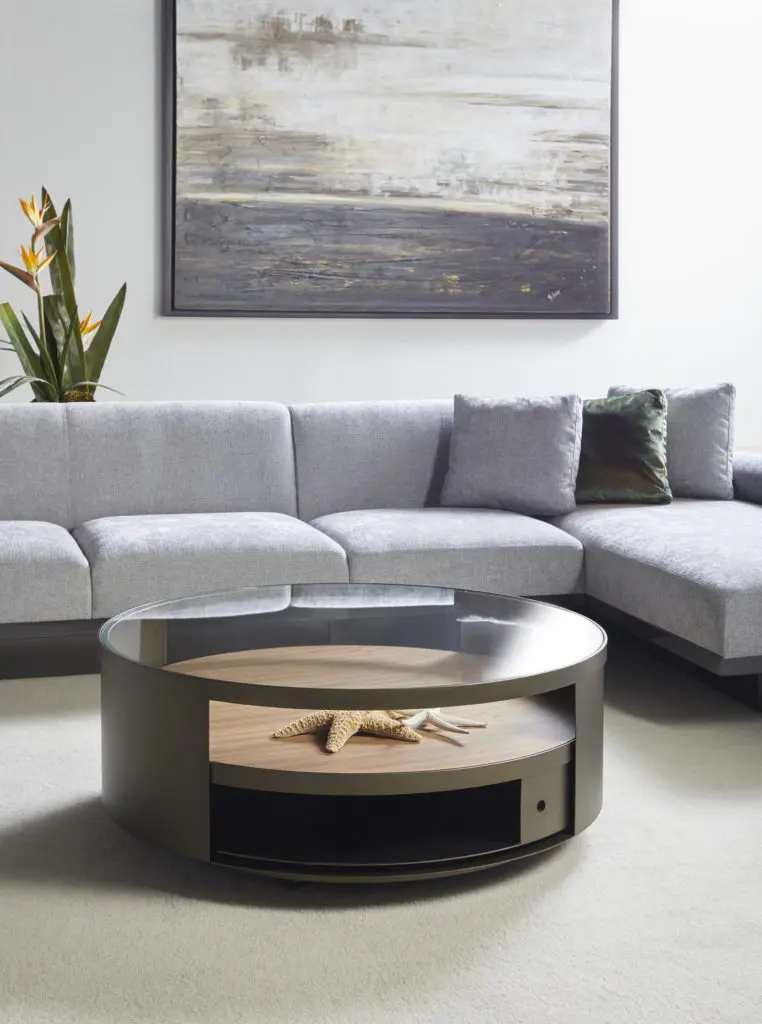 Gray sectional with abstract wall art