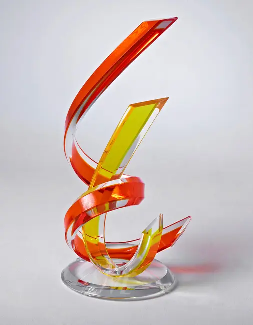 Dynamic glass artwork with sweeping lines.
