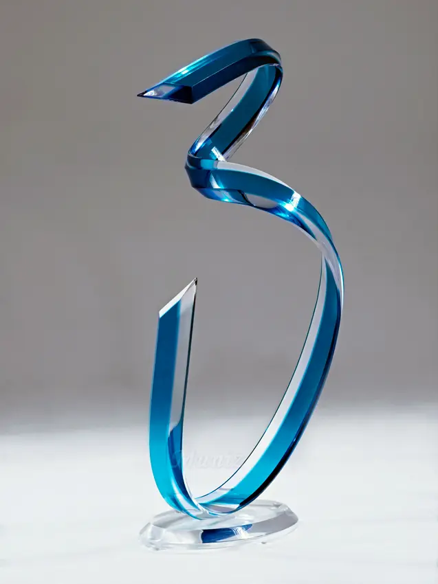 Elegant twisting glass sculpture in blue