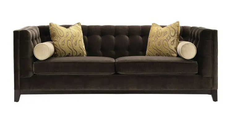 Elegant tufted couch with pillows