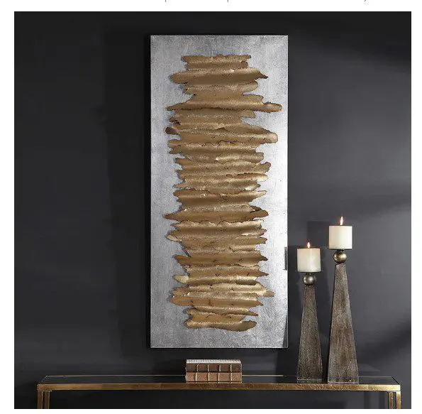 Abstract gold art on dark wall