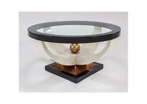 Artistic round coffee table with glass surface