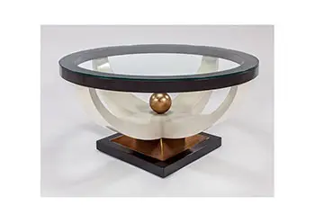 Artistic round coffee table with glass surface