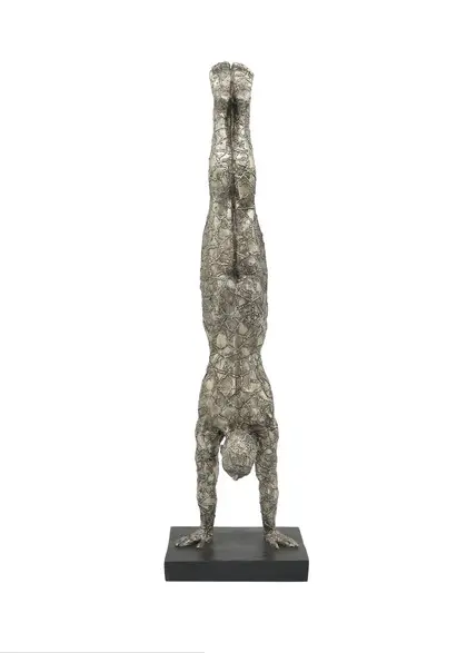 Wire sculpture of person doing handstand