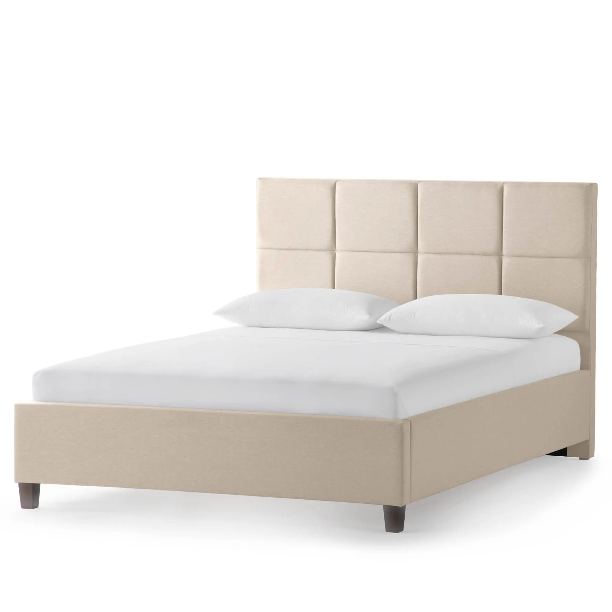 Beige upholstered bed with padded headboard