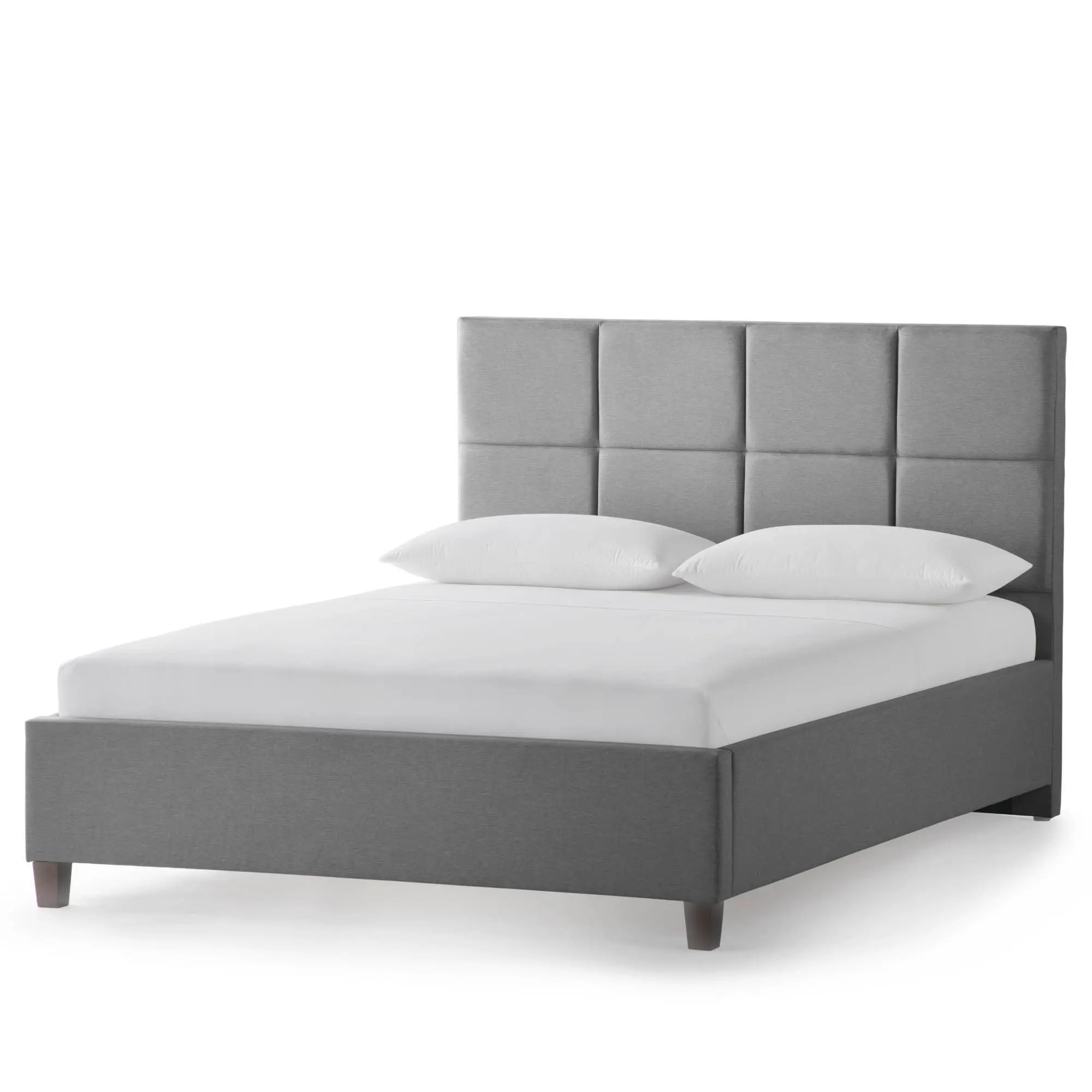 Gray upholstered bed with pillows
