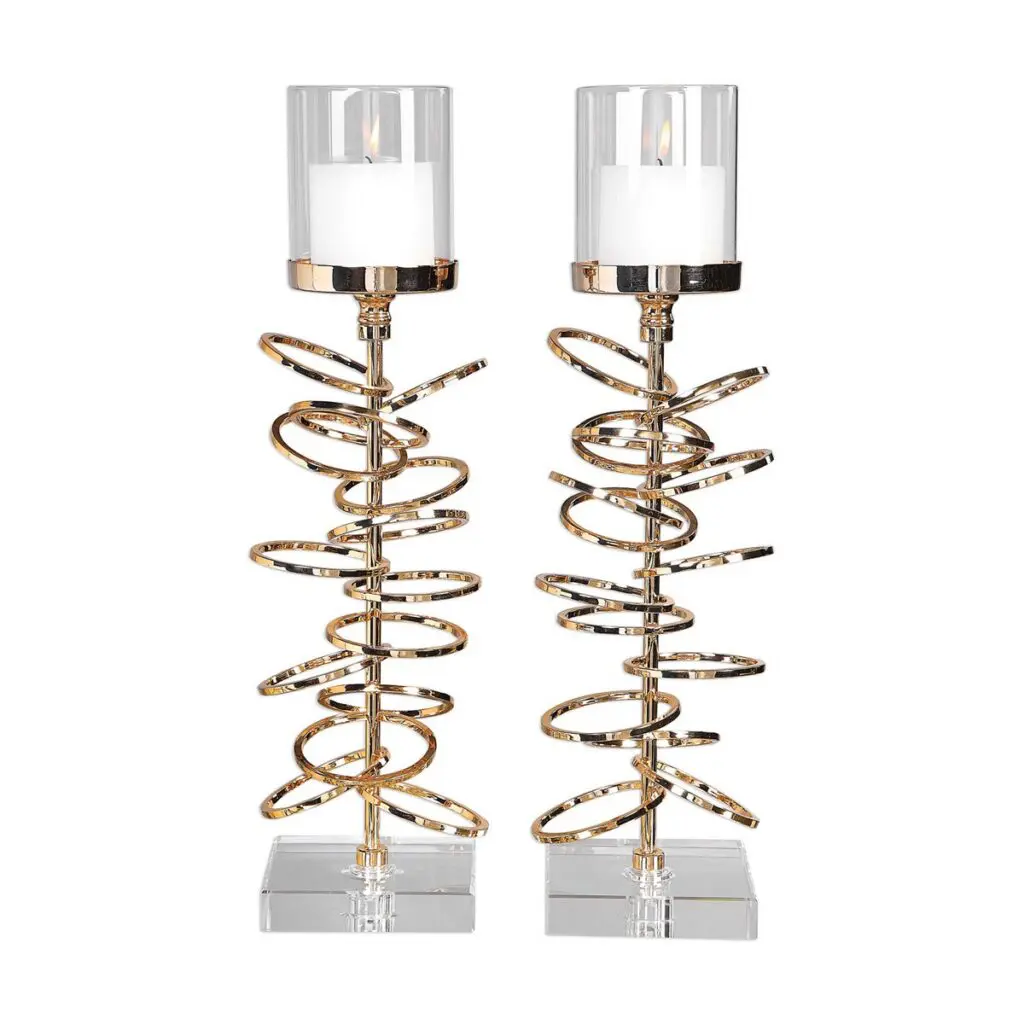 Decorative gold candle holders with glass accents