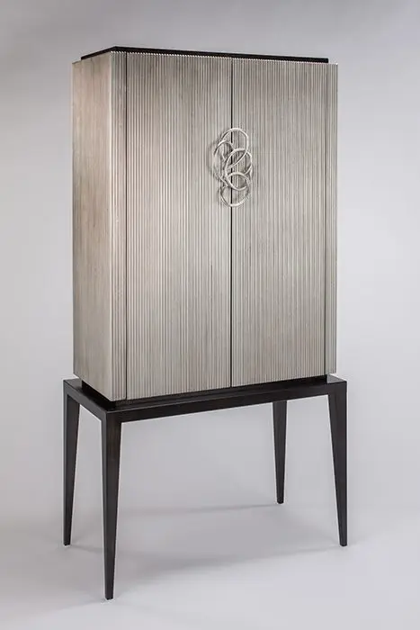 Tall cabinet on sleek black legs