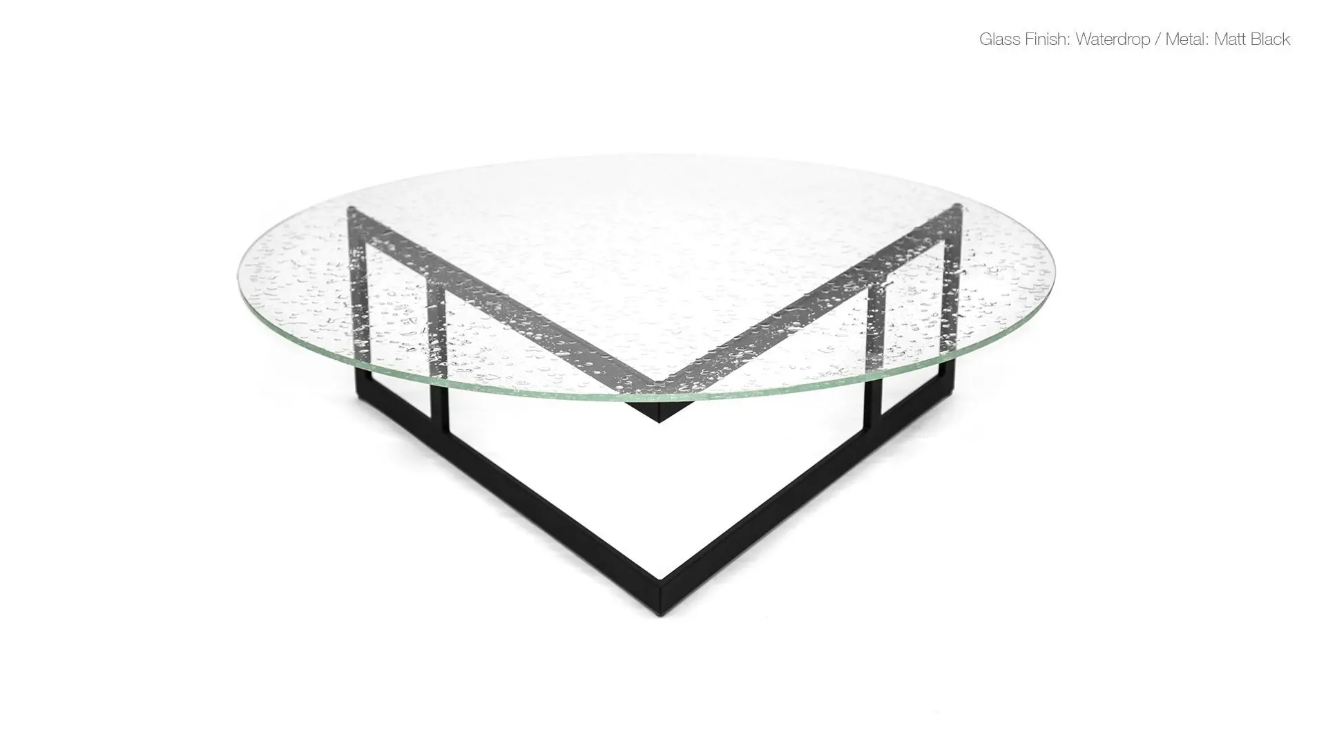 Sleek circular table with textured glass top.