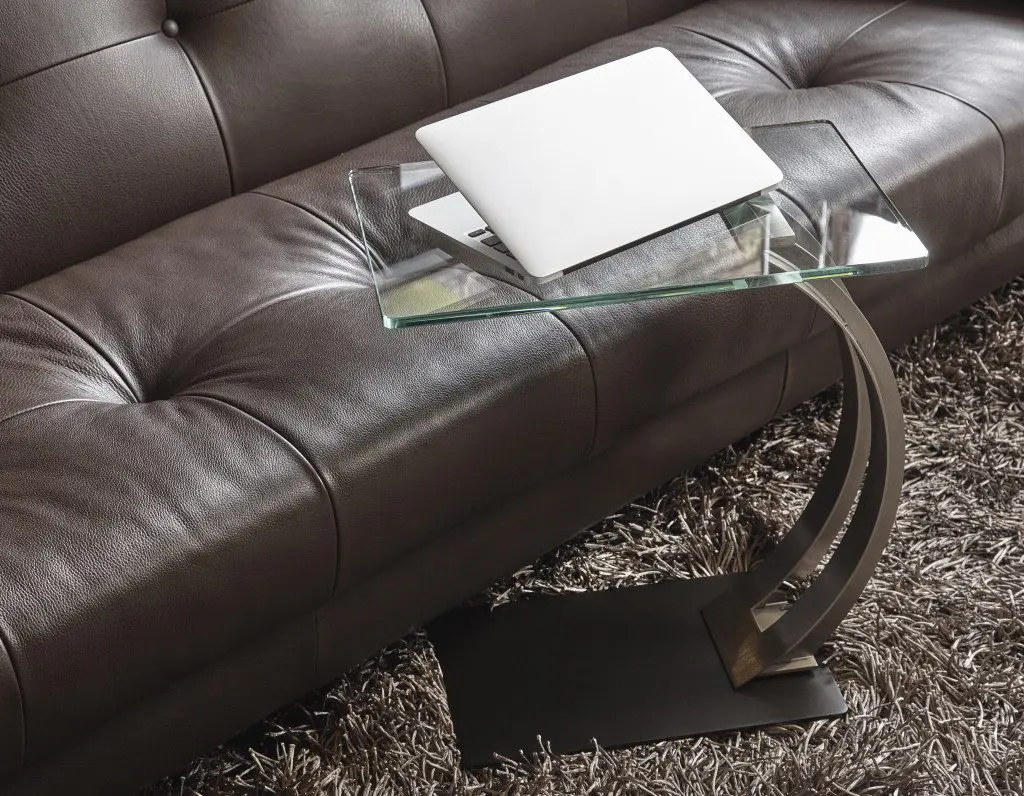 Modern sofa with glass-top side table