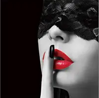 Woman in lace mask with red lips
