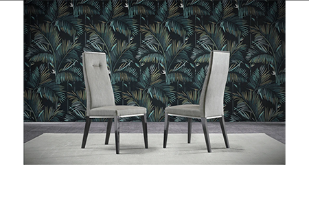 Elegant chairs with tropical wallpaper backdrop