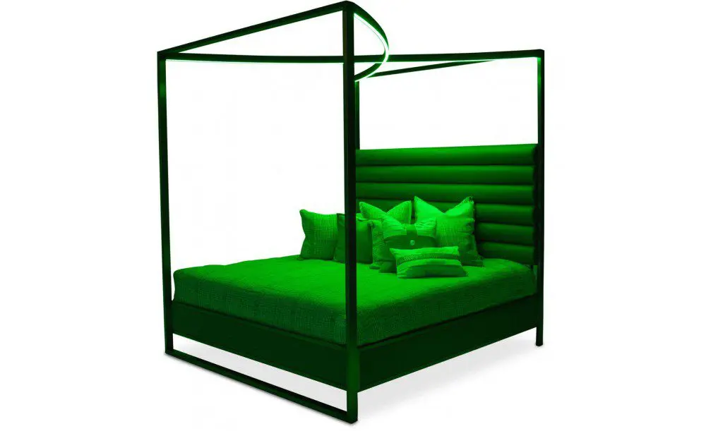 Green canopy bed with pillows