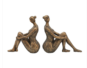 Artistic sculpture of two seated figures