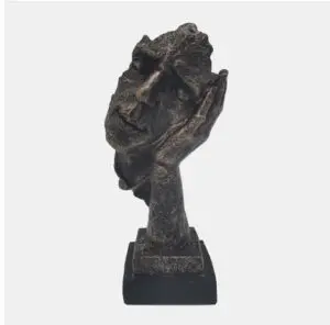 Abstract face sculpture on a pedestal