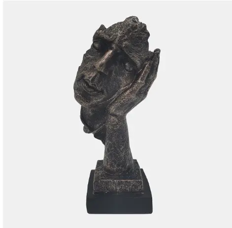 Abstract face sculpture on a pedestal