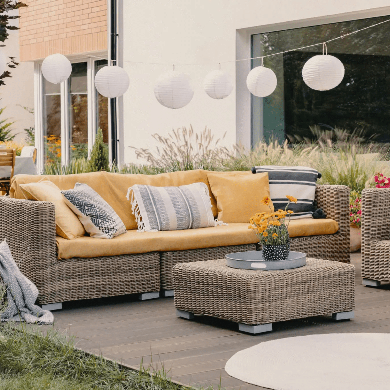 Modern patio setup with decorative lights.